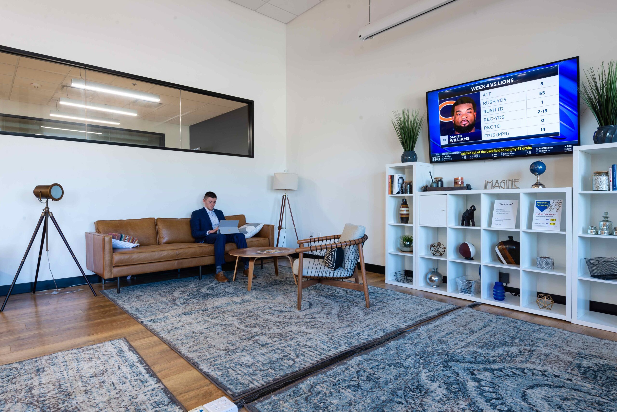 Coworking space in Dallas. A large common area with sofa seating and desks.