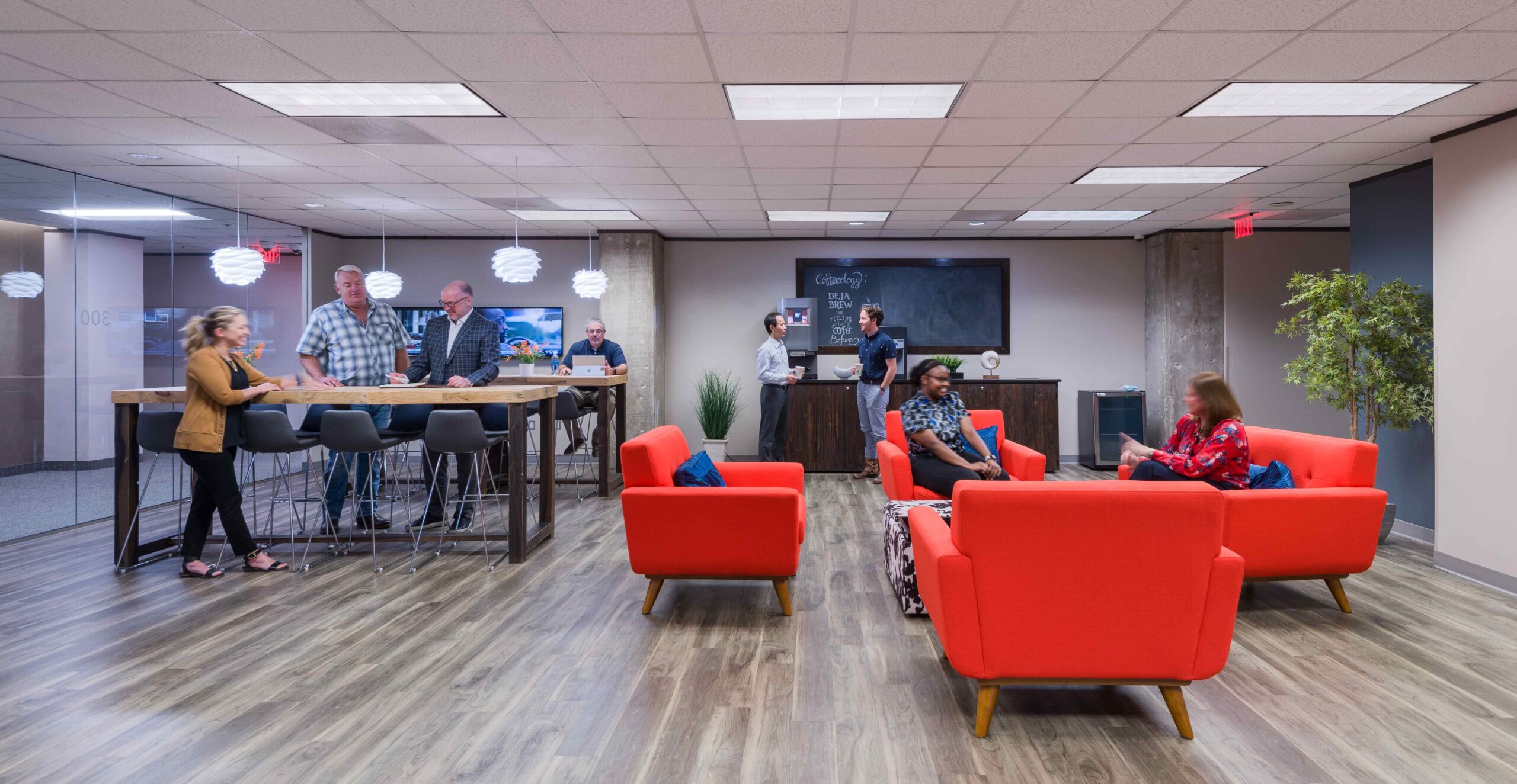 Coworking space North Dallas with 4 sofas and various shared desk spaces.