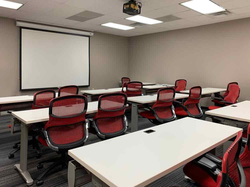 Houston meeting room with many desks to seat 2. Conference room is perfect for trainings or seminars.