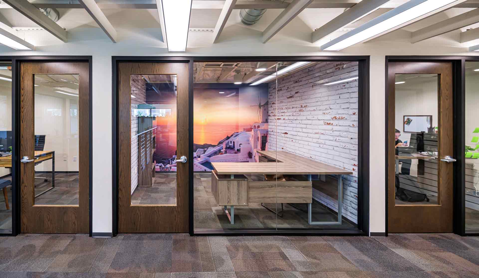 Scottsdale office space with large desk and windows.