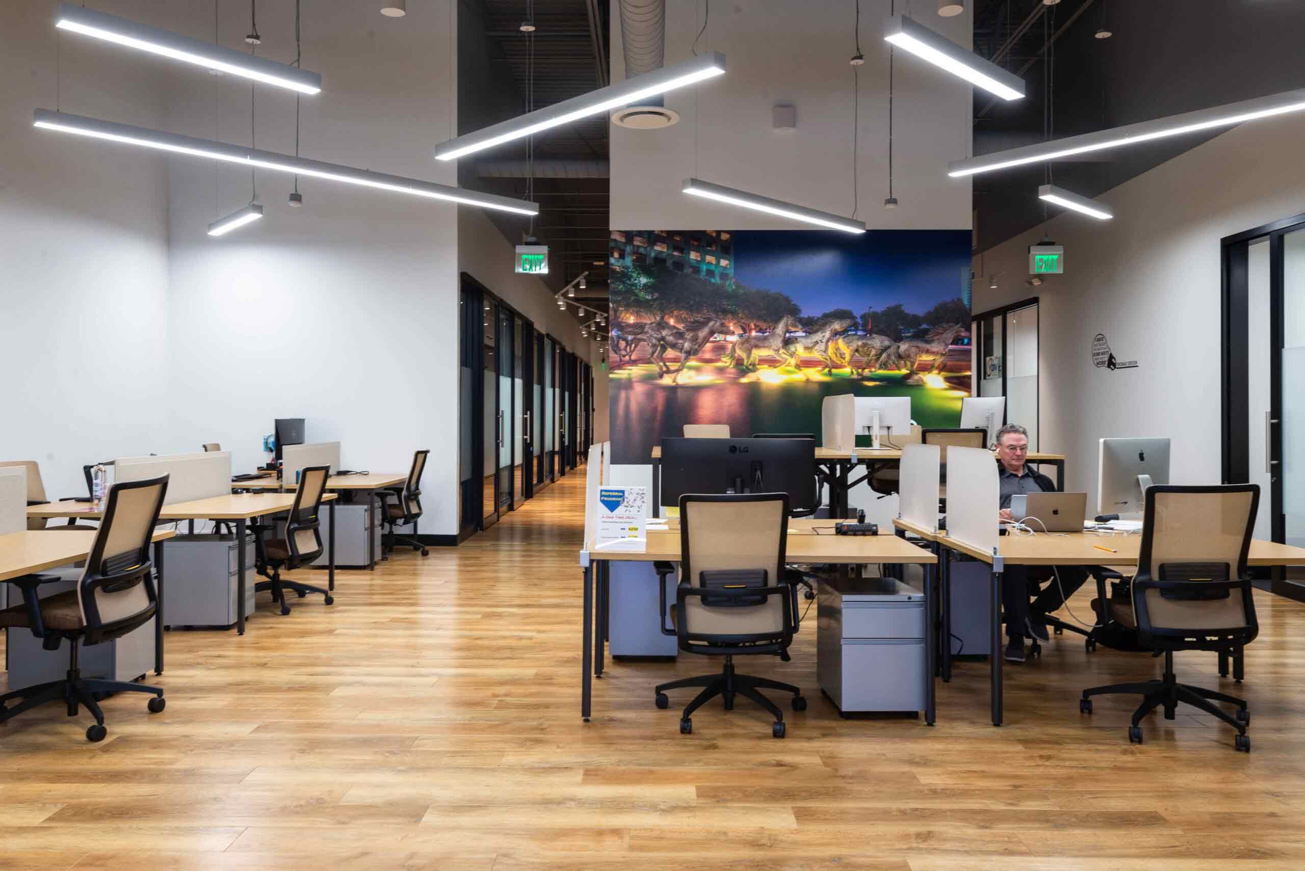 Coworking space in Dallas. Shared office has many single desks for professionals.
