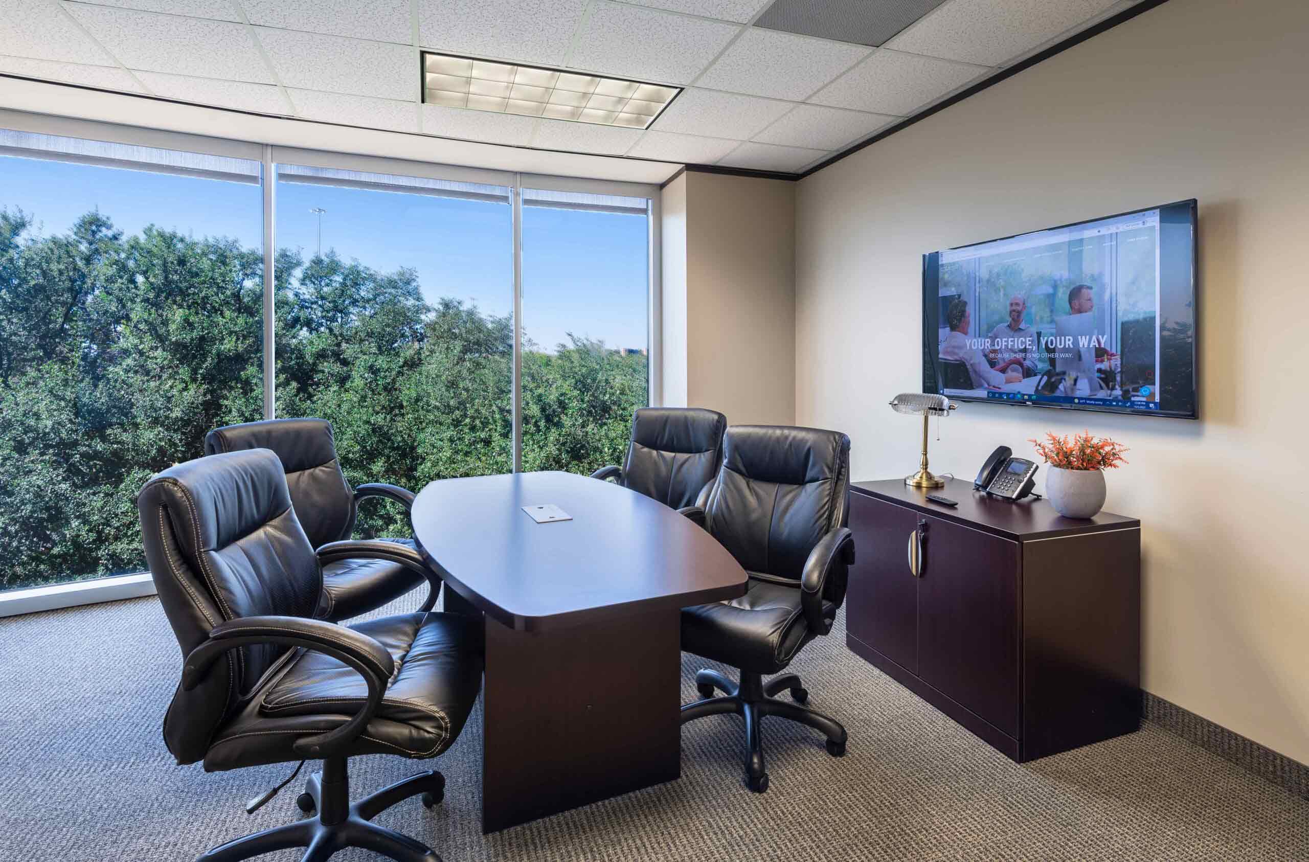 North Dallas meeting space with floor to ceiling windows and natural light.