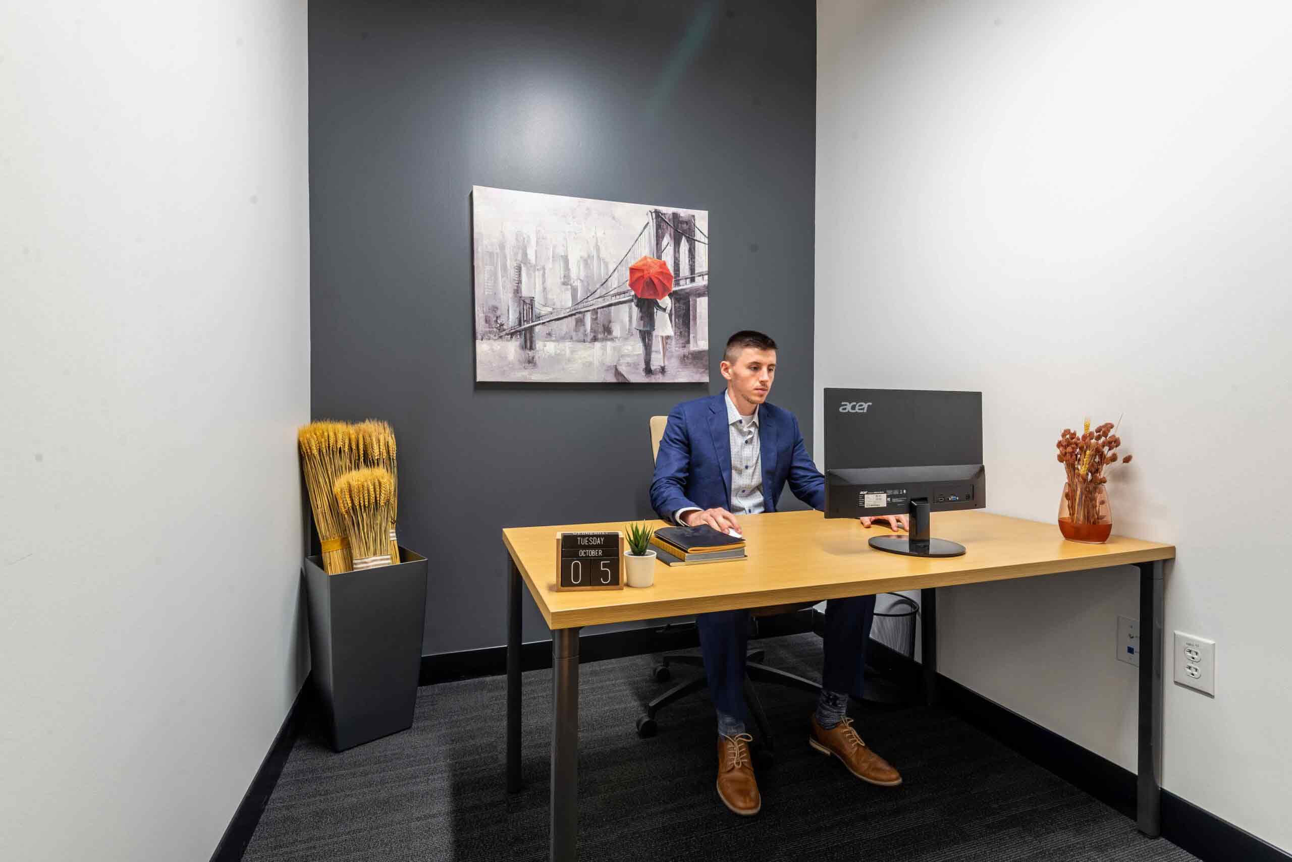 One person sit at a desk in Las Colinas private office