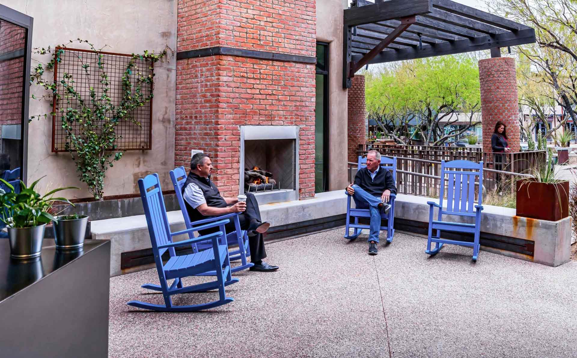 Courtyard and outdoor space with rocking chair and fireplace for casual meeting